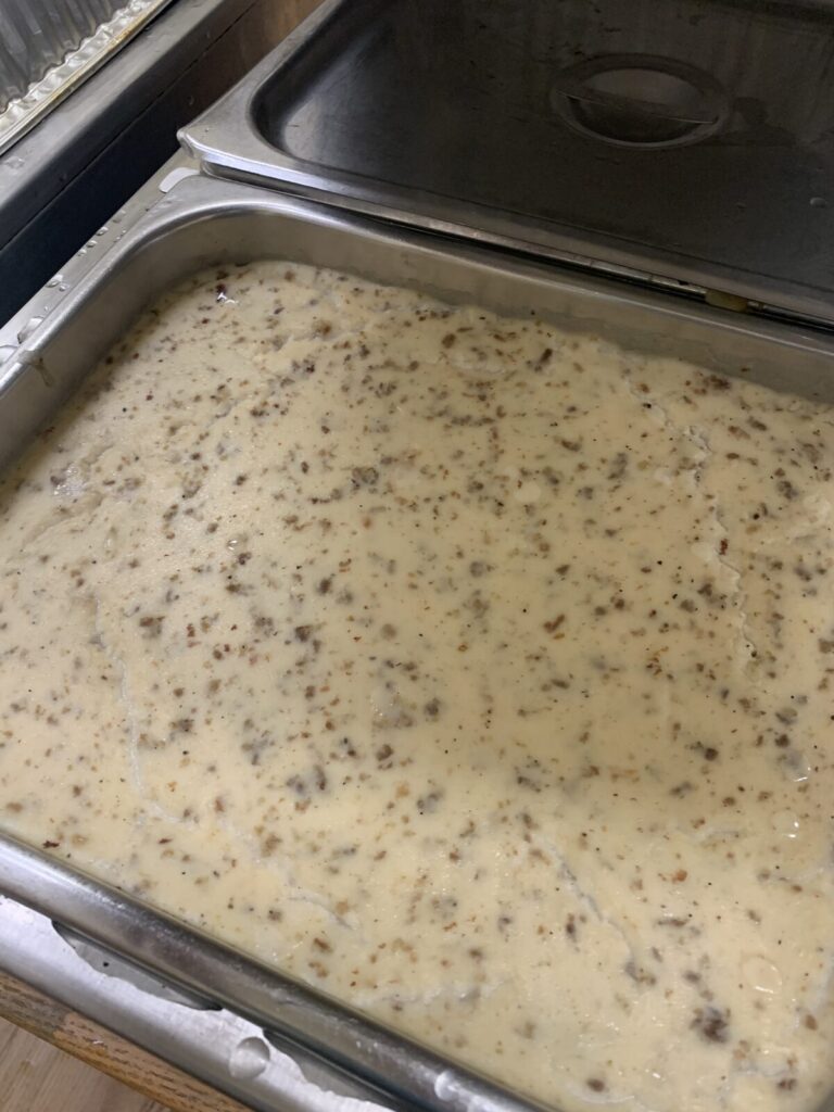A pan of sausage gravy ready to serve