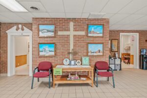 Entry hall with cross and paintings